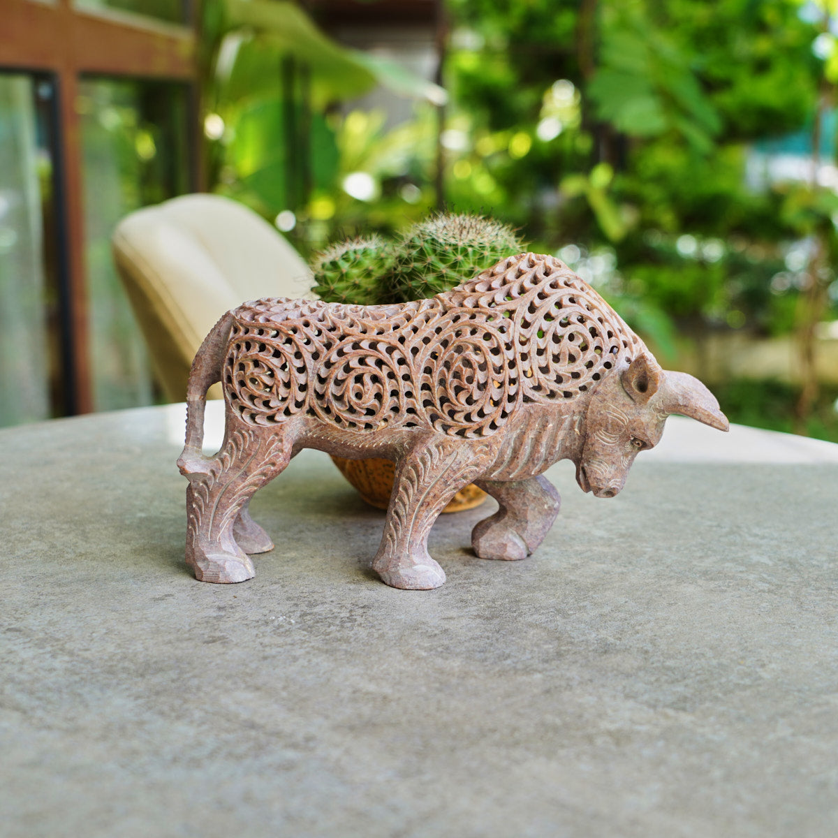 Stone Bull Sculpture with Intricate Jali Carving