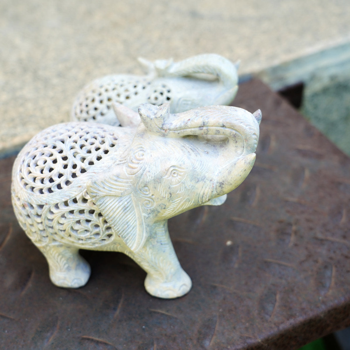 Stone Elephant Trunk Up Sculpture with Intricate Jali Carving